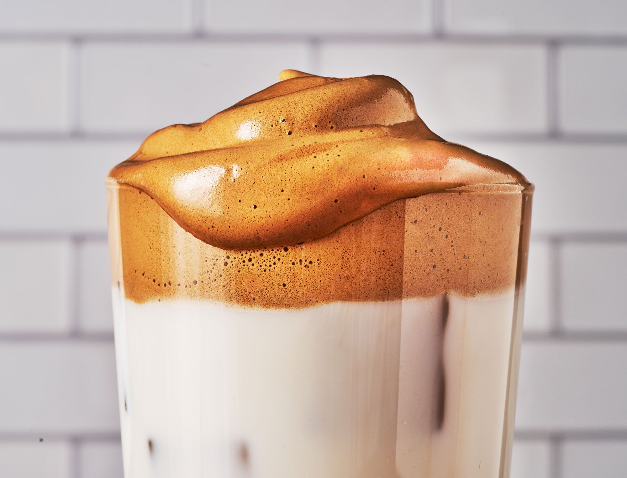 brown foamy coffee in a class cup