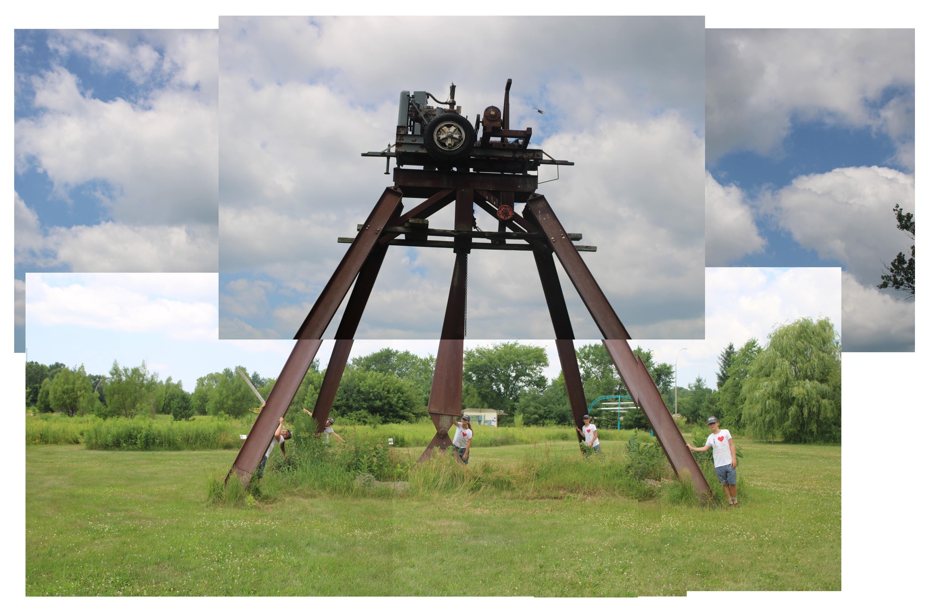 Panorama of a tractor seat connected to large apparatus with 6 rusted metal supports