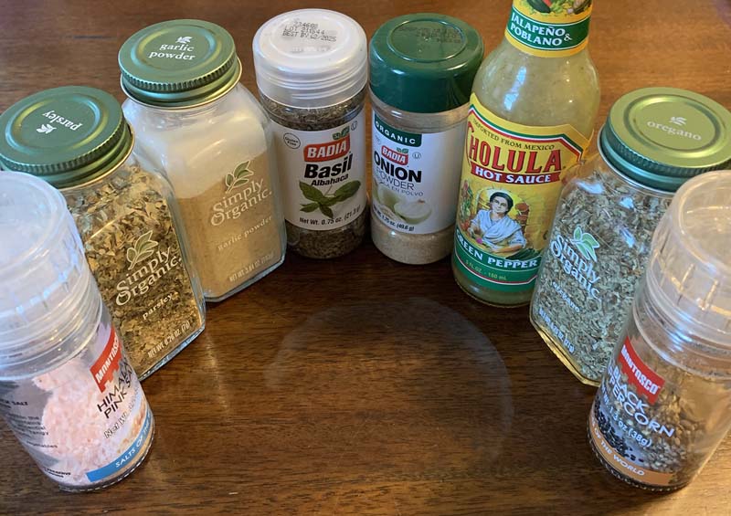 photo of a bunch of spices lined up on a table in a circle