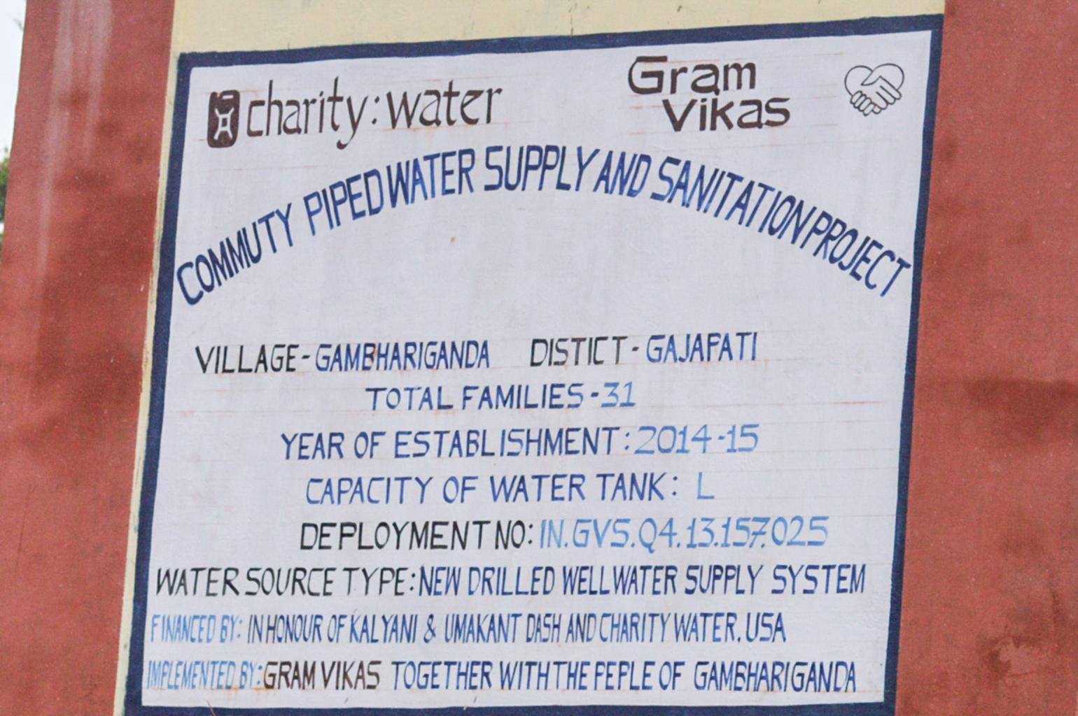 Gram Vikas water sign honoring my parents