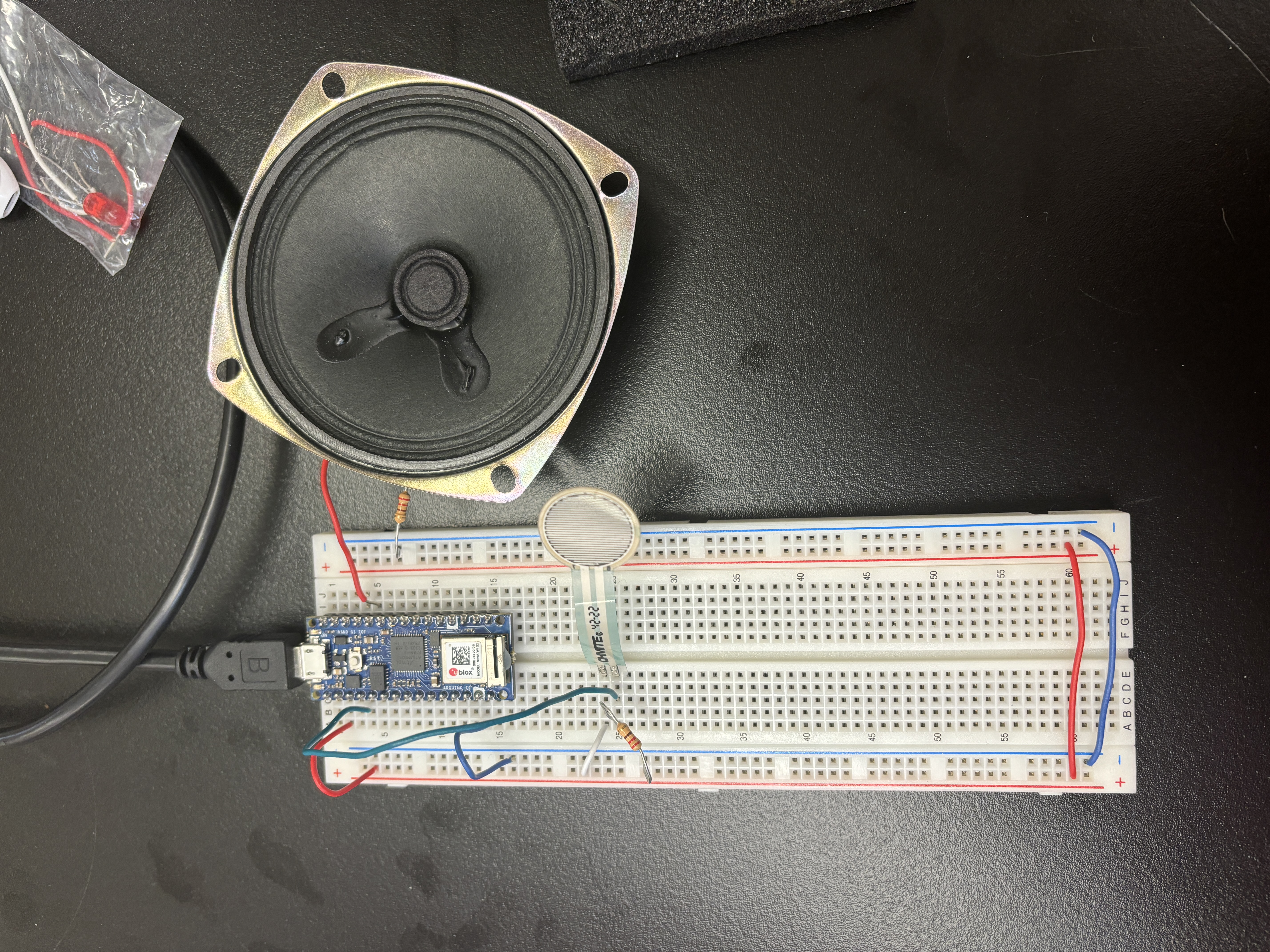 breadboard with analog pressure sensor and output to speaker